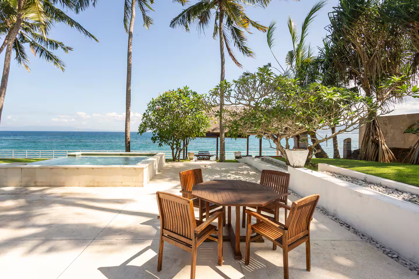 Outdoor dining table beside the swimming pool