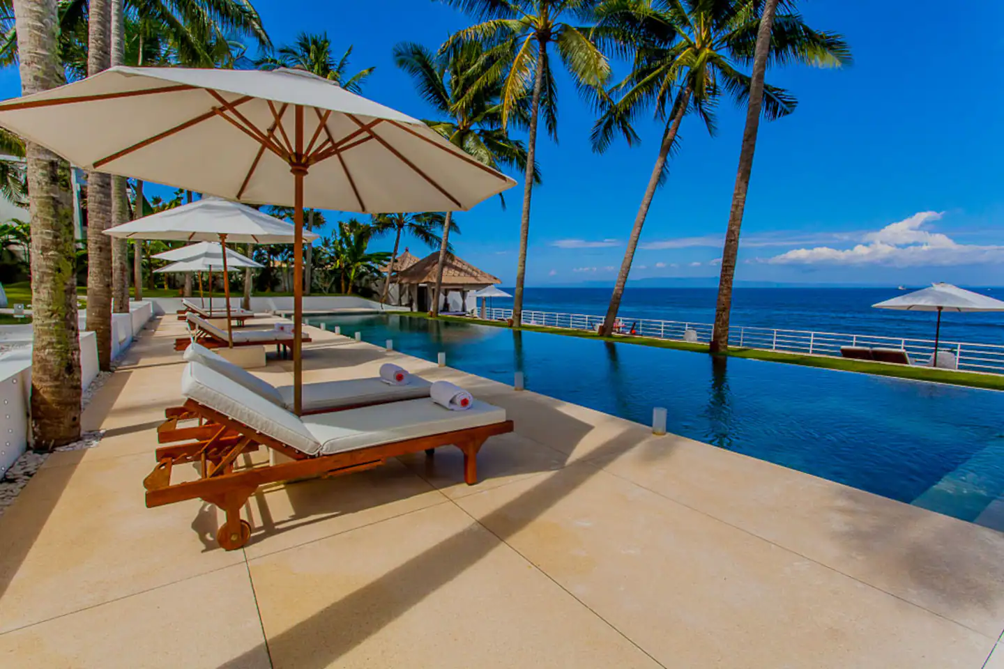 Sun loungers and parasols beside the sea
