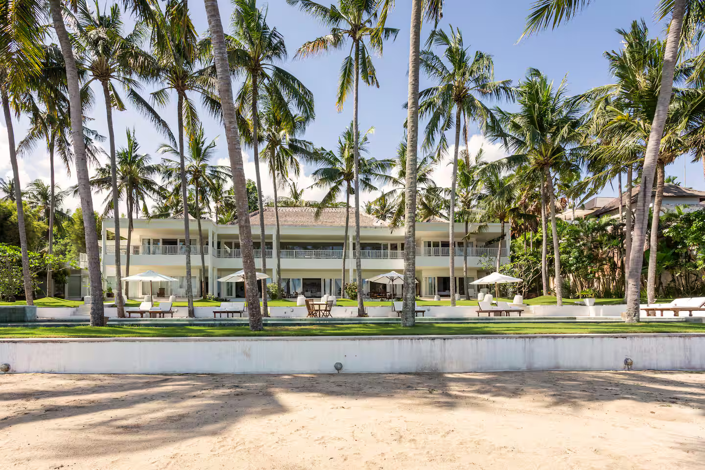 Beachfront villa viewed from the sandy shore