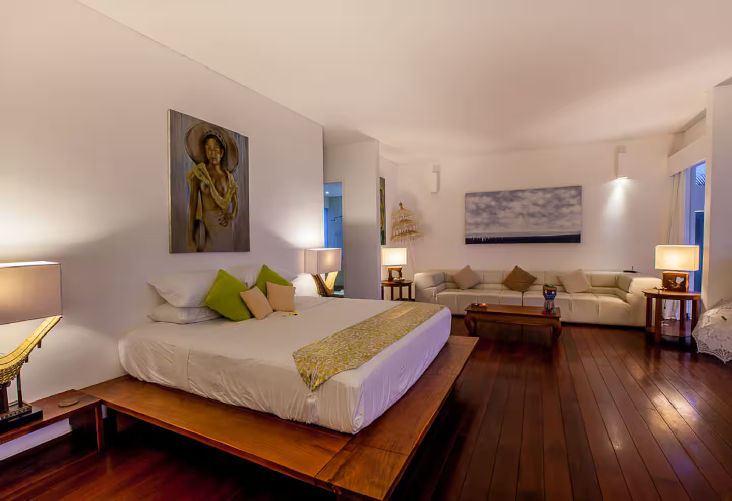 Spacious bedroom with wooden flooring