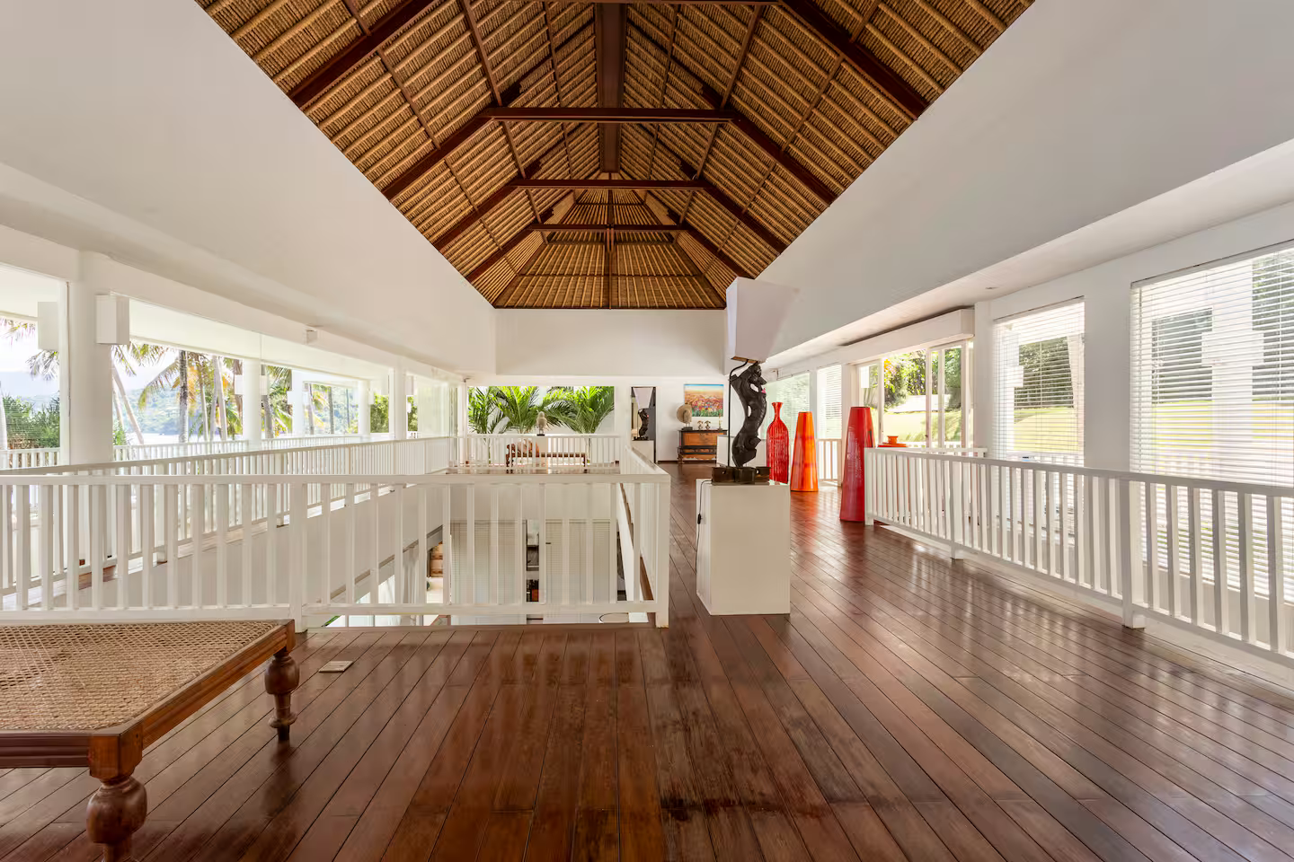 Covered veranda beneath a high timber ceiling