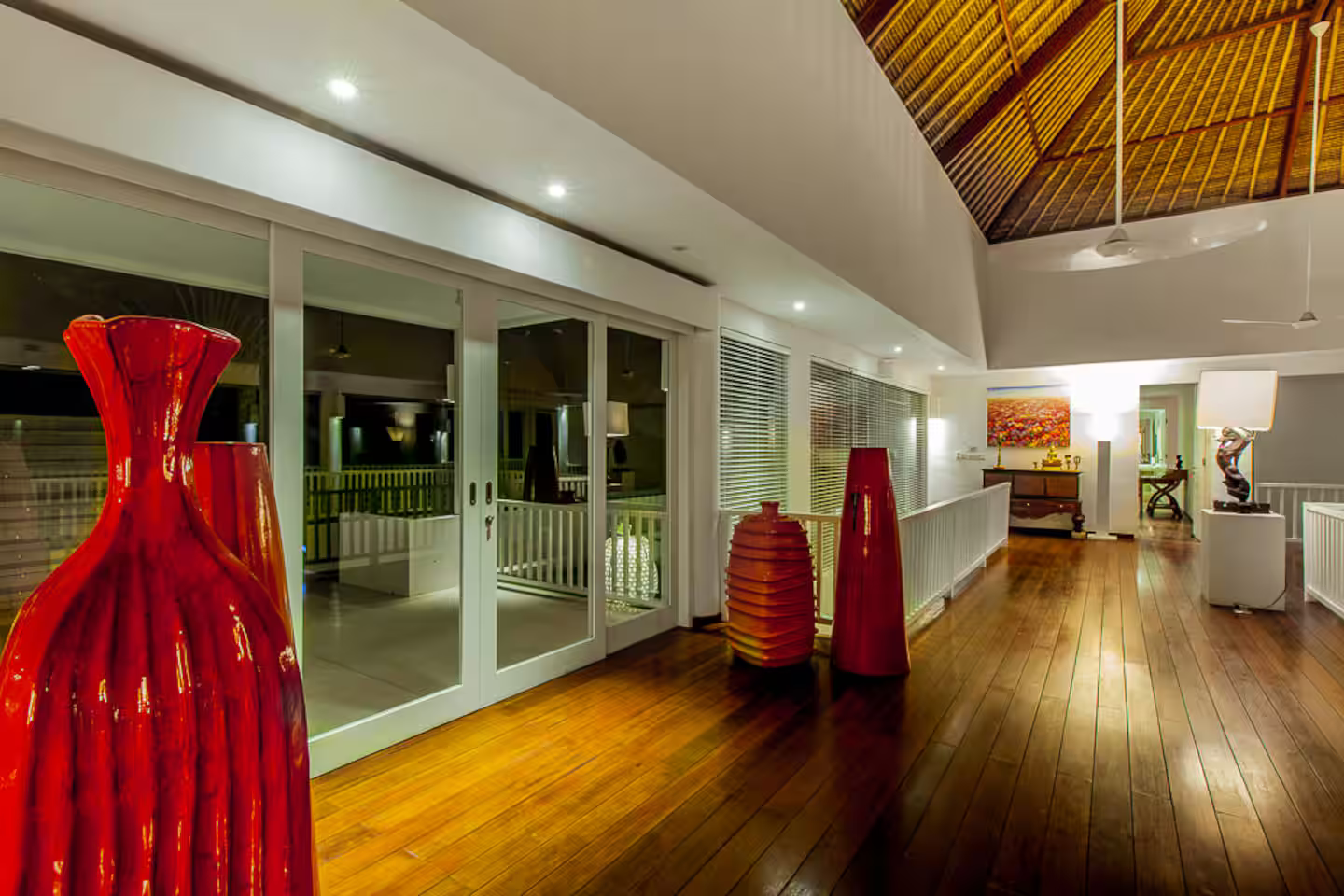 Spacious living area beneath a high timber ceiling