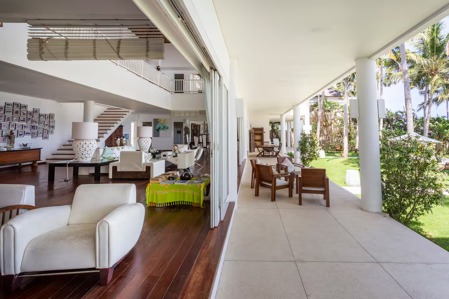 Covered outdoor dining area beside the garden