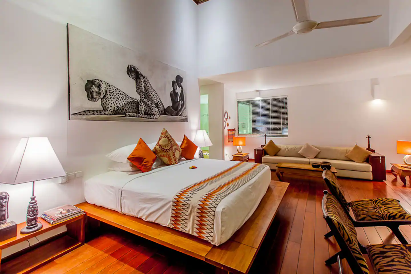 Bedroom decorated with flowers and colourful cushions